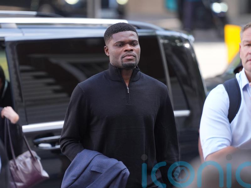 Former Arsenal midfielder Thomas Partey arrives at court to face rape charges