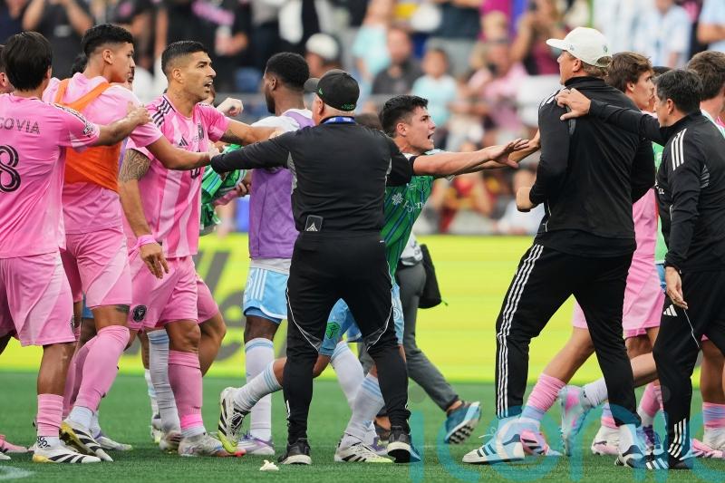 Luis Suarez handed six-match suspension for spitting at opposing coach