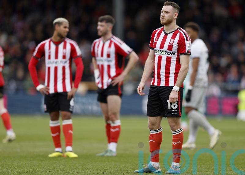 Lincoln see off Luton after late drama