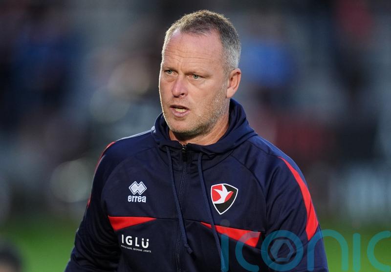 Michael Flynn sacked by Cheltenham following home defeat to Oldham