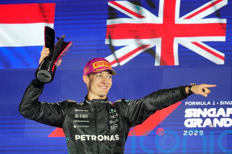 McLaren duo collide on opening lap before George Russell wins Singapore GP