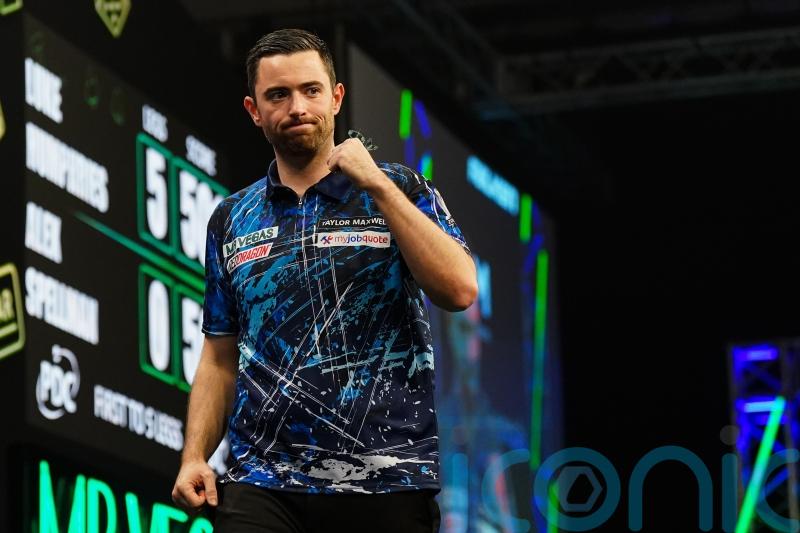 Luke Humphries hits nine-darter to beat Michael Smith at Grand Slam of Darts
