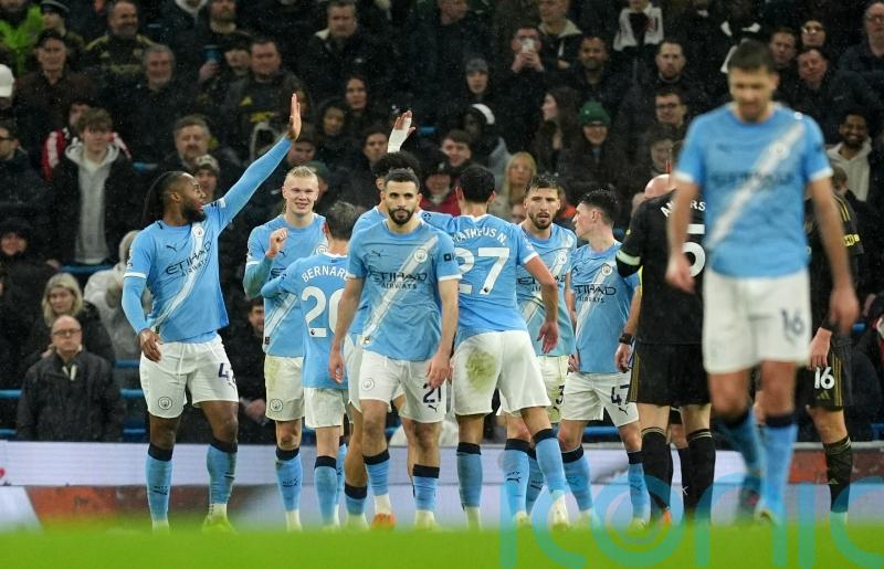 Man City ease past Fulham to move within three points of leaders Arsenal