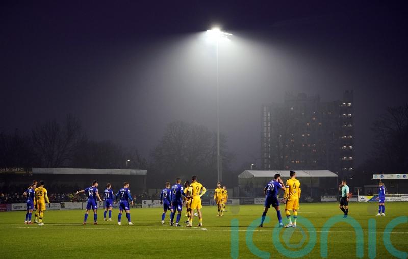 Sutton overcome early dismissal of goalkeeper to beat Woking and exit drop zone