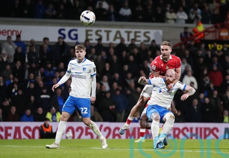 Wrexham maintain promotion push with battling win over Portsmouth