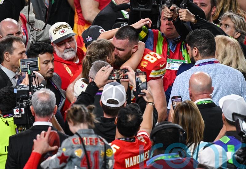 Travis Kelce says fiancee Taylor Swift helped motivate him to re-sign for Chiefs