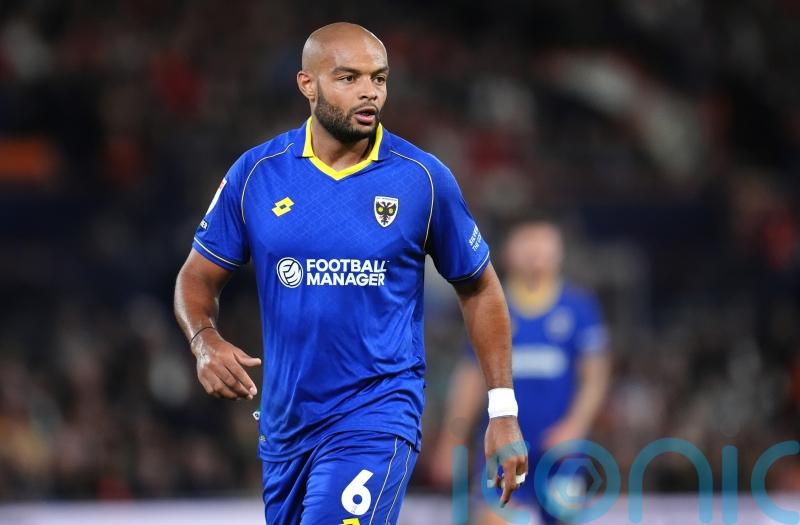 AFC Wimbledon boost slim play-off hopes by easing past Blackpool