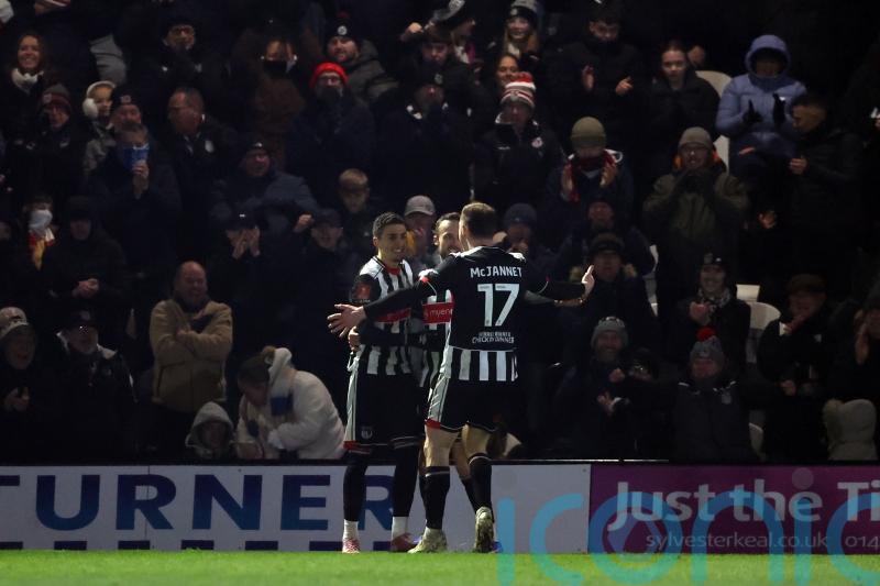 Grimsby maintain play-off push with win at 10-man Crawley