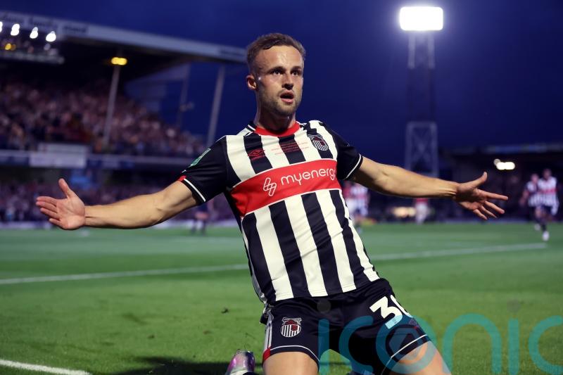 Grimsby finish in style to brush aside Gillingham and keep play-off hopes alive