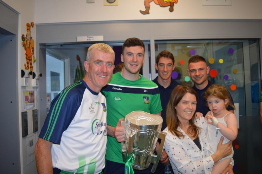 John Kiely, Declan Hannon, Nickie Quaid and Barry Hennessy with three-year-old Allie Sheridan from North Dublin and her mum Jackie