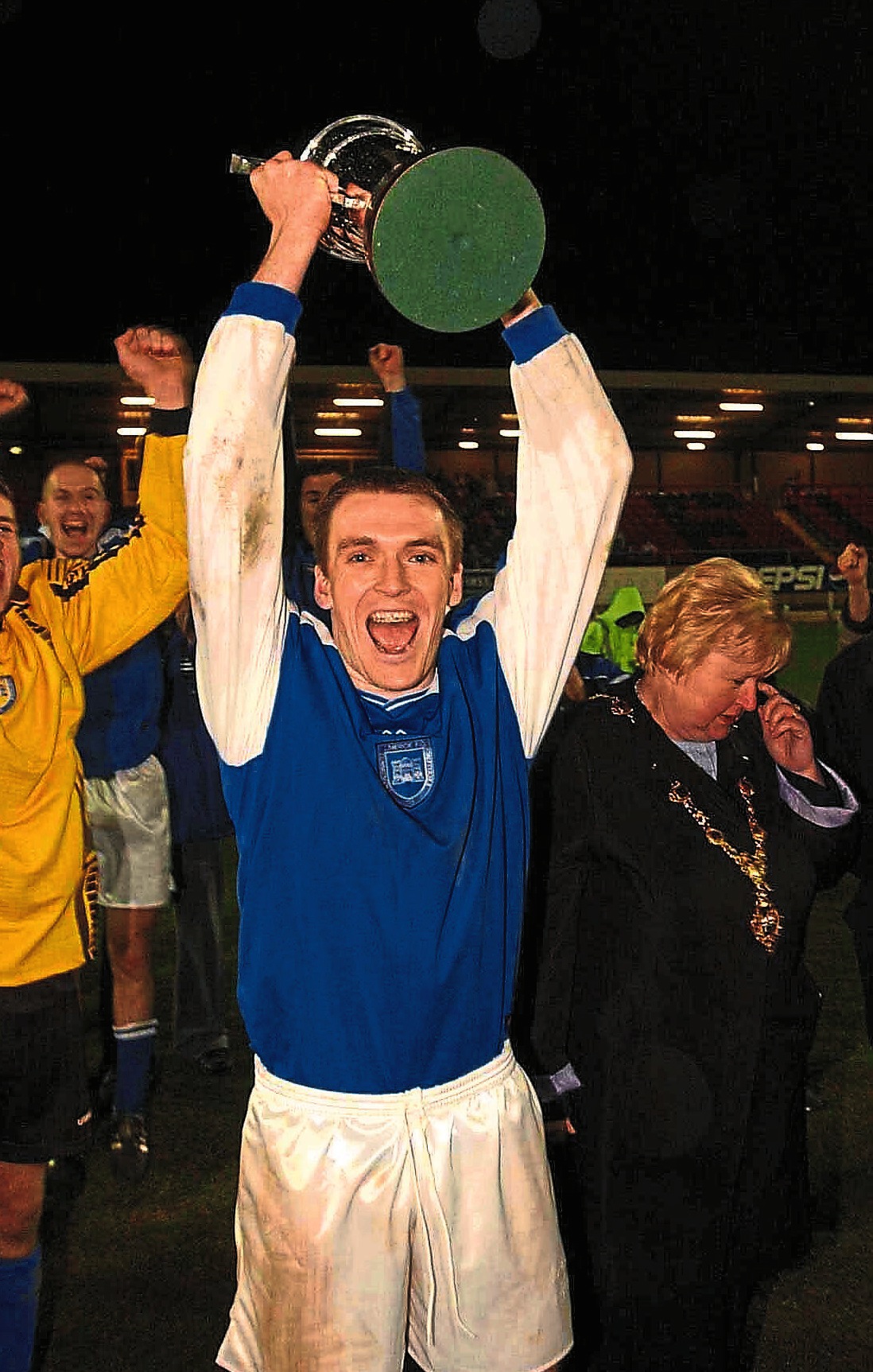 Limerick FC captain Brendan Hughes lifts the trophy after the game