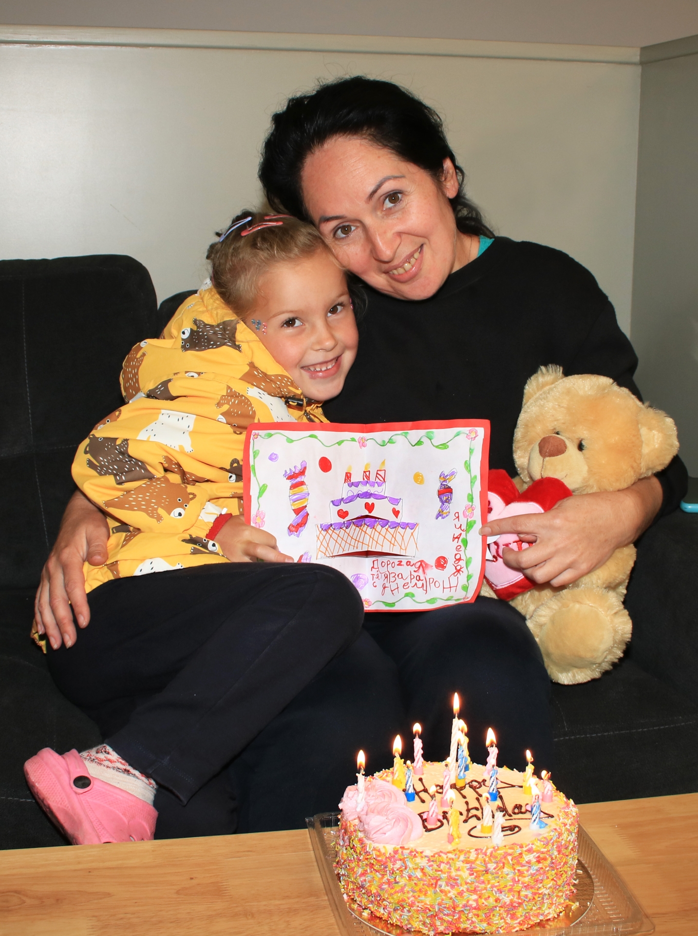  Little Evelina Kharchenko giving a birthday card to Zara Holoushkina | PICTURE: Adrian Butler