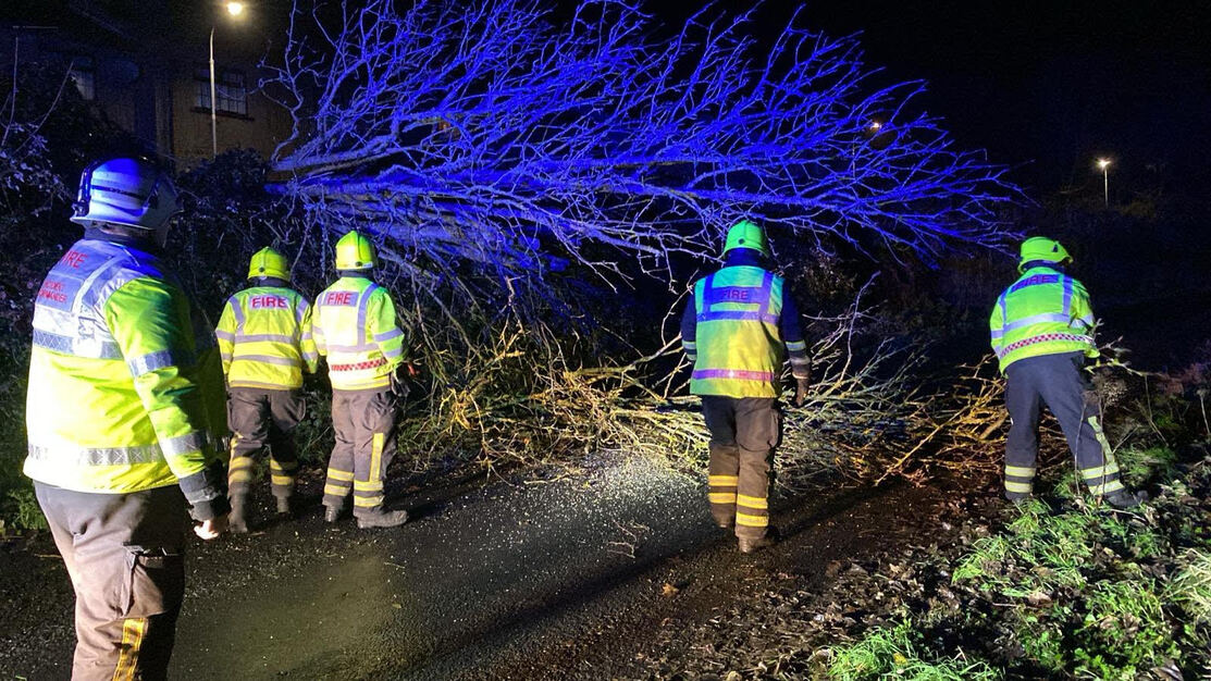 Pictured: Limerick Fire and Rescue and the Limerick City and County Council working last night to ensure main roads has an ability to allow traffic through.